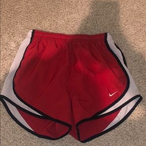 Red Nike shorts
